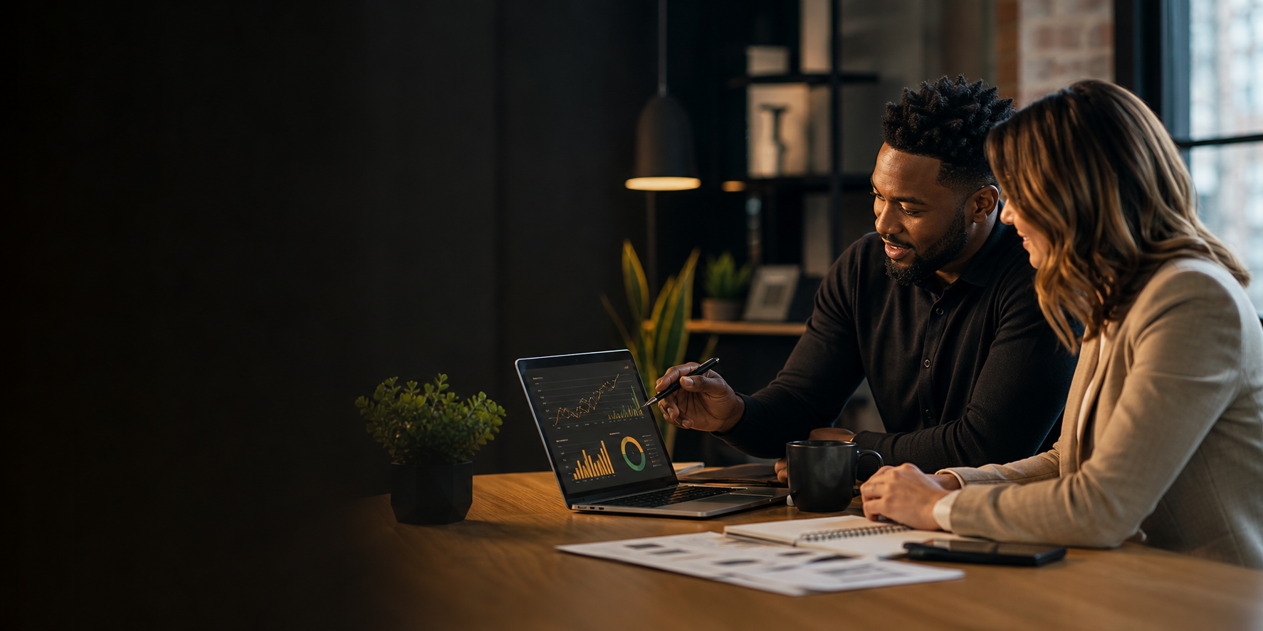 A marketing strategist reviewing campaign analytics with a small business owner